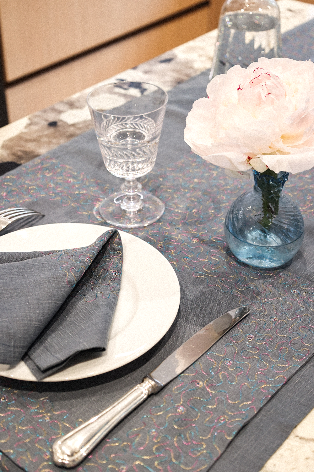 Aghabani Embroidered Placemat on Blue Linen