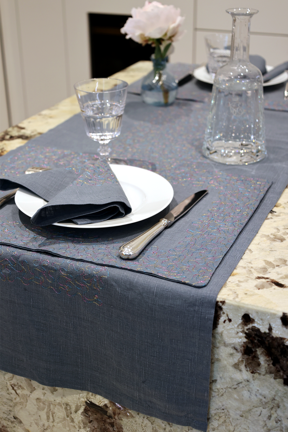 Aghabani Embroidered Placemat on Blue Linen