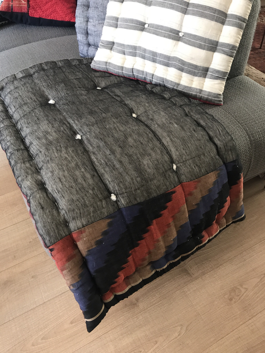 Handcrafted cotton and linen quilt mattress black ikat.