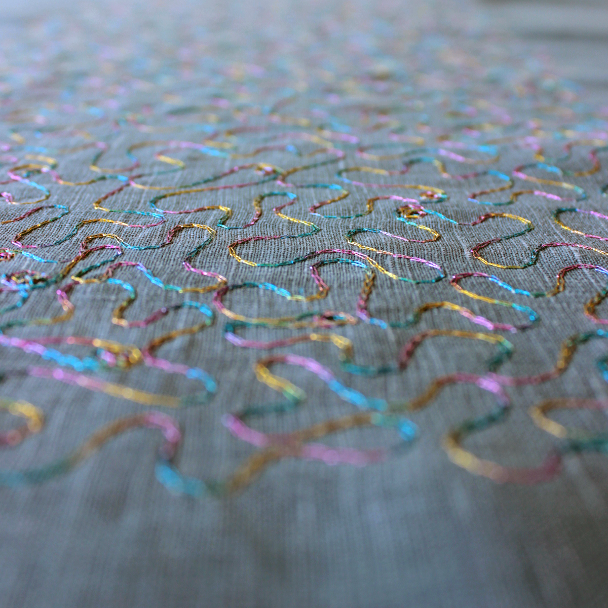 Aghabani Embroidered Placemat on Blue Linen