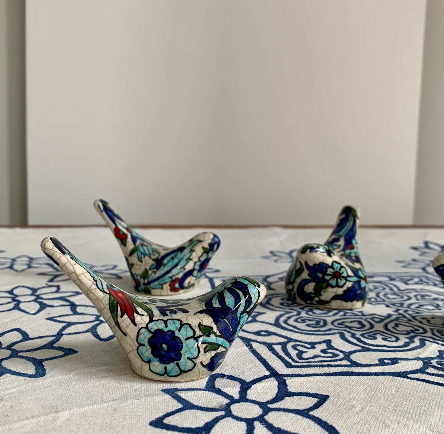 Set of 4 hand painted glazed ceramic mini birds