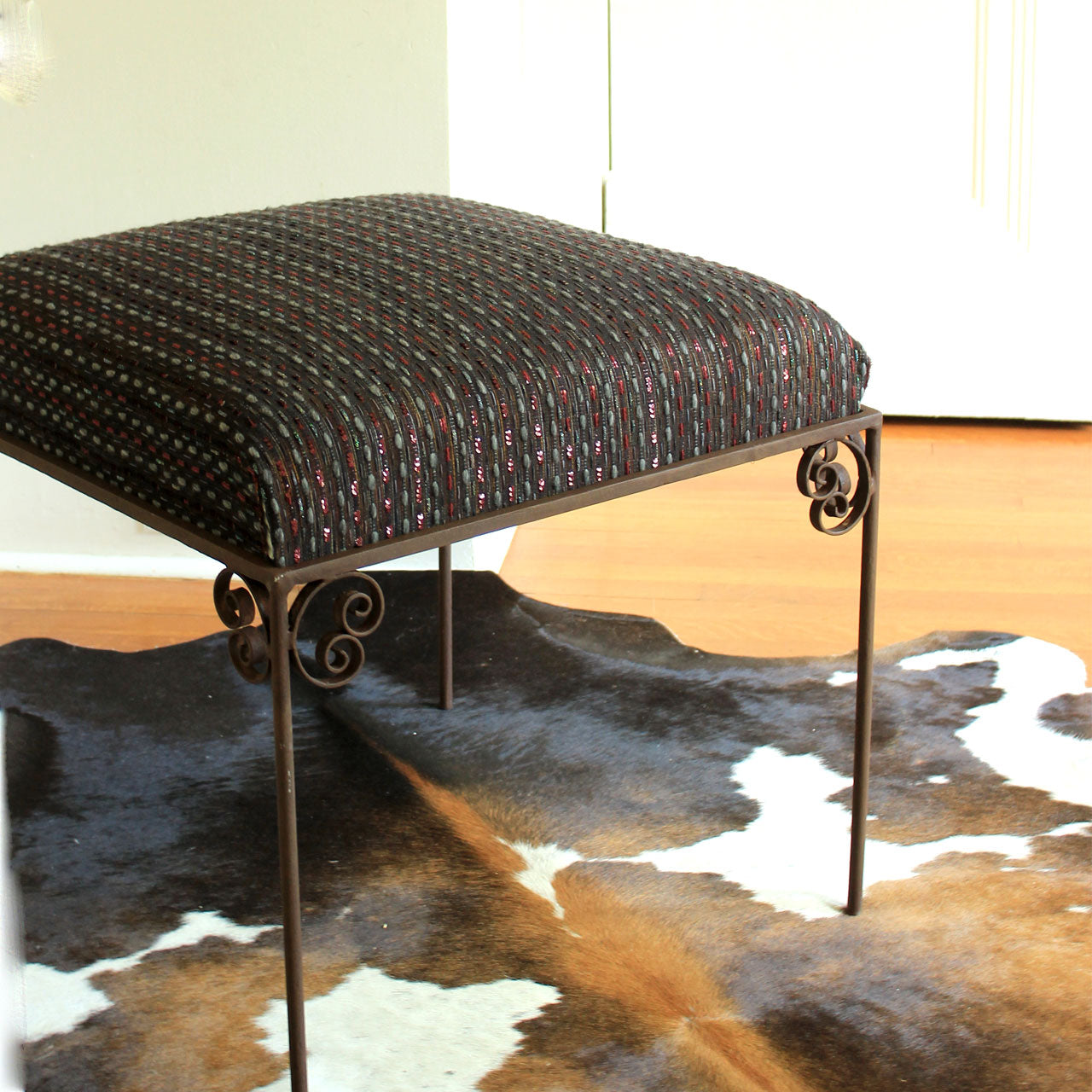 Repurposed wrought iron upholstered ottoman