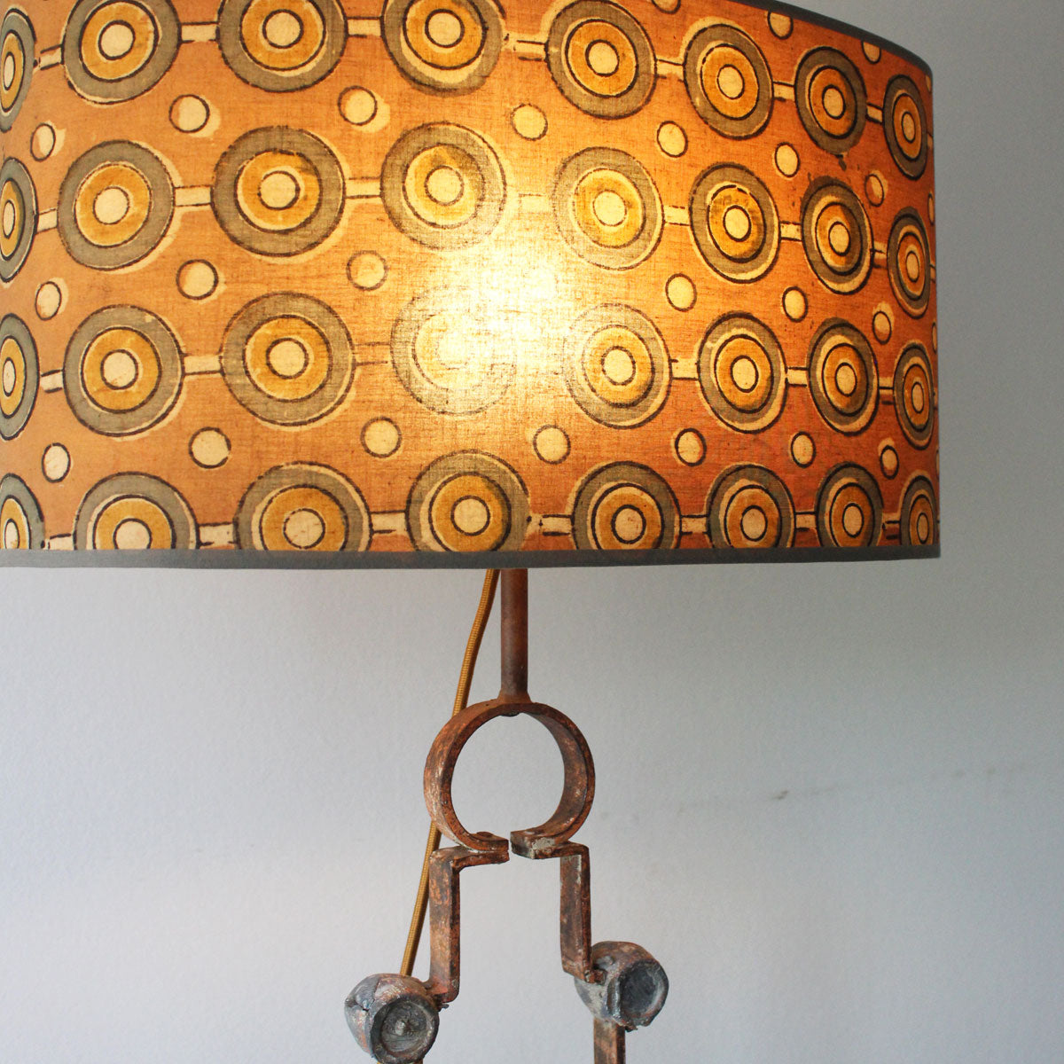 Salvaged Gate Transformation: Rustic Table Lamp with Iron Medallions and Silk Shade