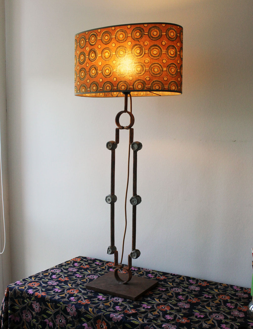 Salvaged Gate Transformation: Rustic Table Lamp with Iron Medallions and Silk Shade