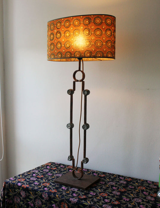 Salvaged Gate Transformation: Rustic Table Lamp with Iron Medallions and Silk Shade