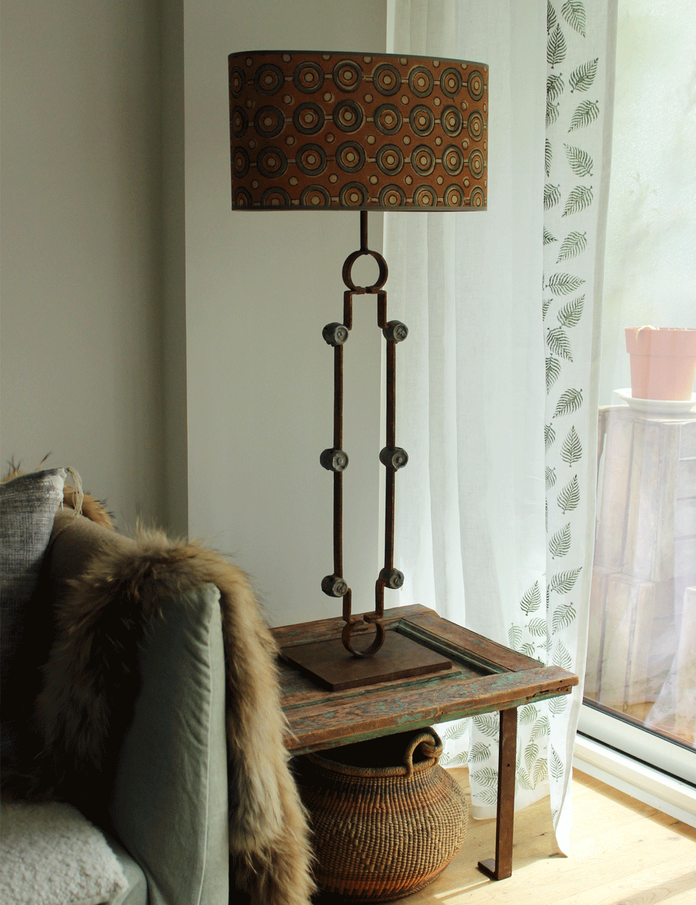 Salvaged Gate Transformation: Rustic Table Lamp with Iron Medallions and Silk Shade