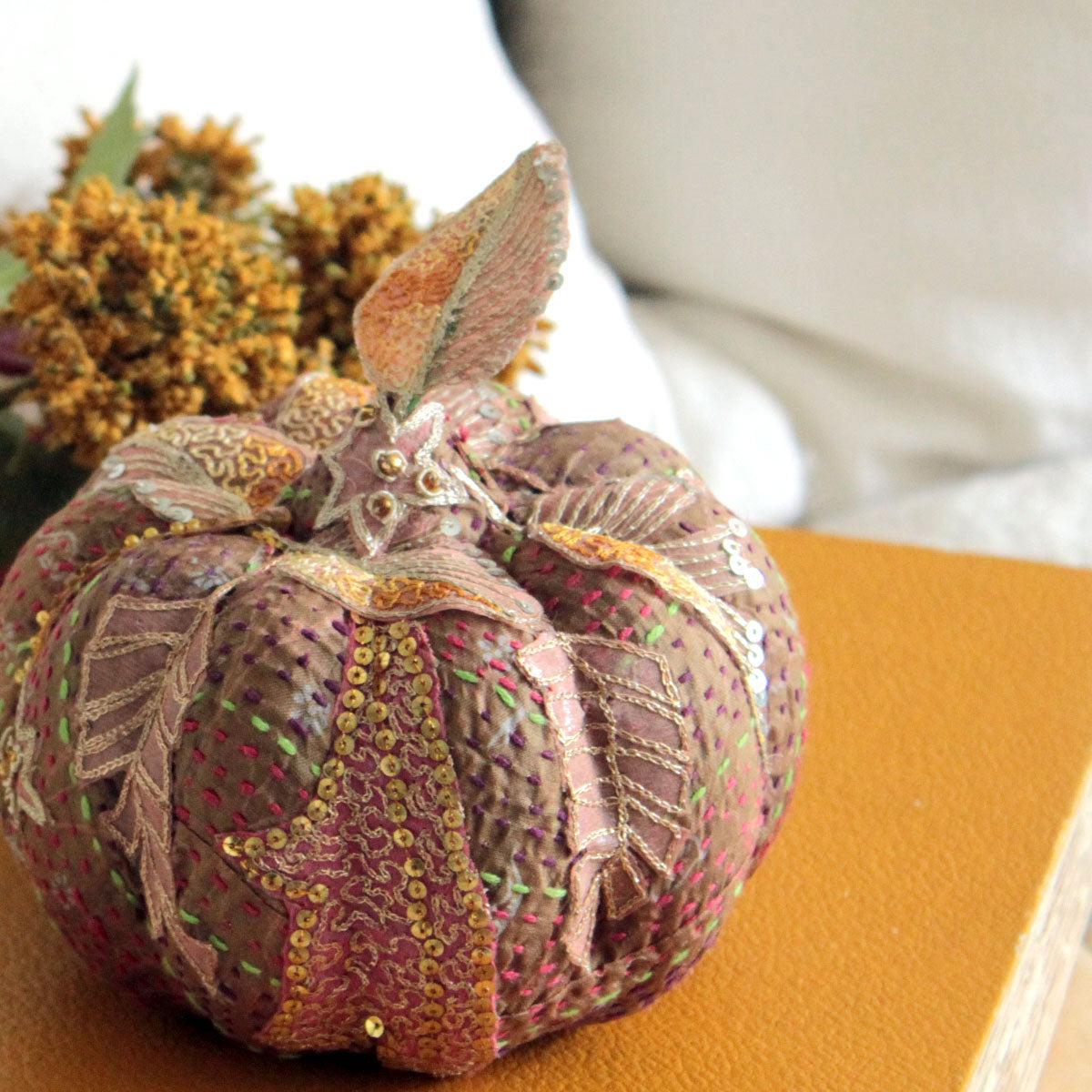 Silk embroidered pumpkin with antique fabric